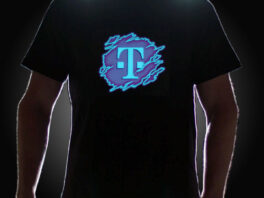 Guy wearing T-Mobile Logo on LED shirt lighting up in dark setting