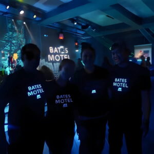 Group of people wearing promotional light up t-shirts