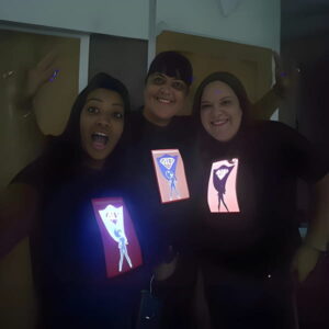 Group shot of 3 girls wearing illuminated shirts