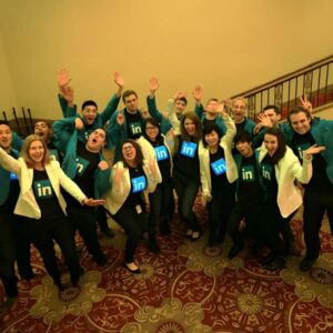 Large Group Photo of people posing with LinkedIn custom LED Shirts lighting up to sound and music